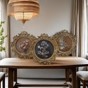 Retro decorative photo frame set, vintage ornate gold carved design for tabletop and home decor.
