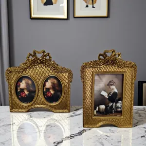 French vintage gold resin photo frame set with bow carving, perfect for luxury home tabletop decor.