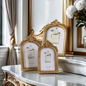 Retro gold arched photo frames set, antique style decorative tabletop picture frames for home decor.