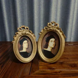 Close-up of vintage European style ornate gold resin photo frames set of two