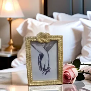 Gold textured picture frame detail showing hands sketch in upscale bedroom setting.