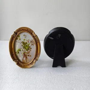 Vintage oval picture frames with elegant floral print and sturdy back stand.