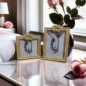 Detail view of the elegant gold photo frame featuring intricate rope knot texture and glossy finish.