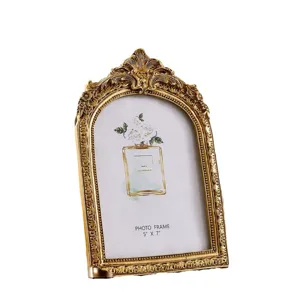 Vintage gold arched photo frame with ornate baroque design for home decor, size 5x7 inches.