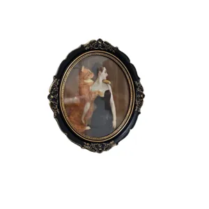 Élégant cadre photo ovale en résine vintage avec ornements baroques noir et or raffinés