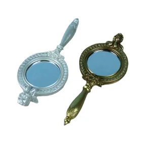 Set aus europäischen Vintage-Handspiegeln mit kunstvoll geschnitzten Harzgriffen