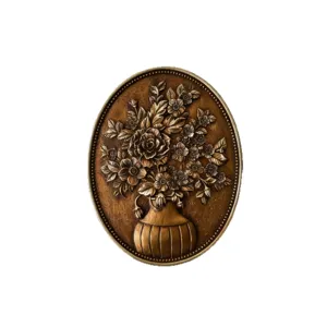 Vintage European bronze relief wall plaque featuring detailed flower bouquet design.