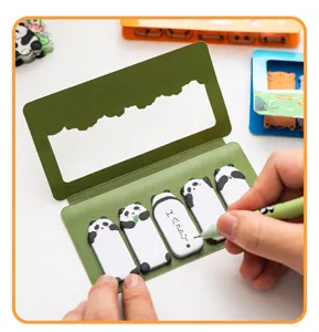 Close-up of cute panda index tabs with handwritten text on a sticky note detail