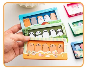 Close-up of cute cartoon animal shaped sticky notes featuring pandas and capybaras