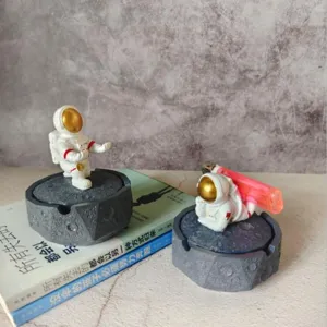 Creative astronaut resin ashtray desktop decoration ornament, unique moon surface design gift.
