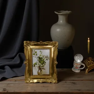 Vintage gold resin photo frame with baroque floral carving for home decor tabletop display.