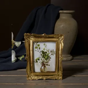 Vintage gold resin photo frame with baroque ornate design for tabletop and wall decor