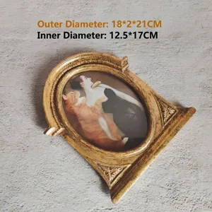 Detailed view of vintage gold resin picture frame showing outer and inner dimensions