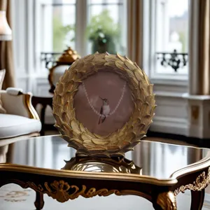 Vintage resin gold photo frame detail showing delicate leaf carved border and luxury decor.