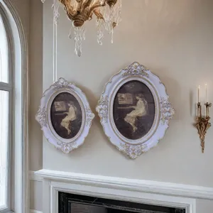 Exquisite French vintage Rococo oval picture frame with resin gold-painted details for wall decor.