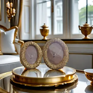 Vintage resin oval picture frame detail, European gold decorative tabletop ornament display.