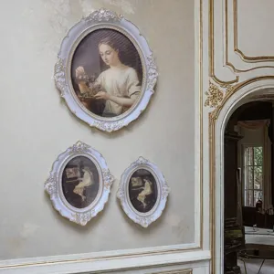 French vintage rococo resin oval frame detail showcasing elegant carved gold trim decor.
