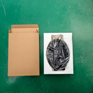 Oval vintage resin photo frame with ornate gold top and protective packaging box.