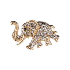 Detailed view of a gold-tone elephant brooch with sparkling rhinestone embellishments