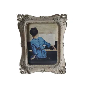 Victorian vintage carved picture frame with classic art print, resin tabletop decor for home.