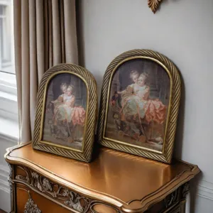 Detailed view of arched vintage gold resin frames with an elegant twisted rope texture.