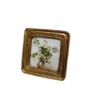 Vintage European golden photo frame with embossed floral carving for home decor display
