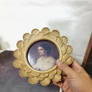 Vintage golden round shell-carved resin photo frame with classical portrait detail