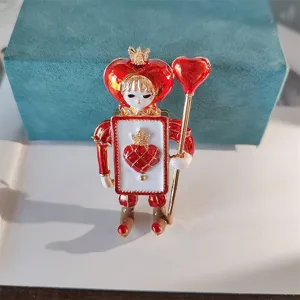 Detailed view of vintage heart soldier brooch featuring red enamel and gold finish