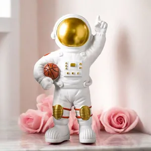 Detailed view of white astronaut figurine holding a basketball with a glossy gold visor