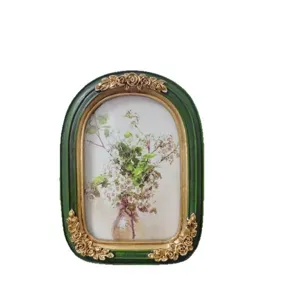 Vintage French style resin picture frame with ornate gold floral relief