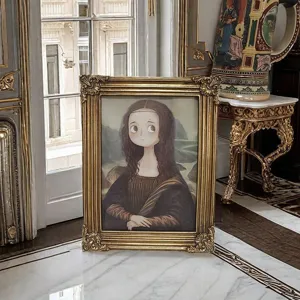 Close-up of ornate gold carved resin picture frame in a luxury vintage style