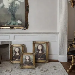 Detailed view of ornate golden resin frames in various sizes with classical carvings