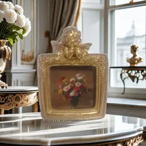 Vintage French style gold picture frame featuring cherub angel carving and floral oil painting