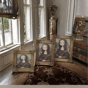 Ornate vintage gold resin photo frames with cartoon Mona Lisa art in a luxury interior.