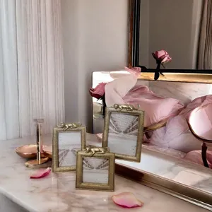 Luxury set of three gold resin photo frames featuring decorative leopard ornaments
