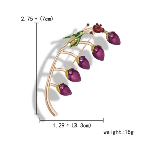 Detailed view of enamel flower brooch with dimensions 7cm x 3.3cm and 18g weight