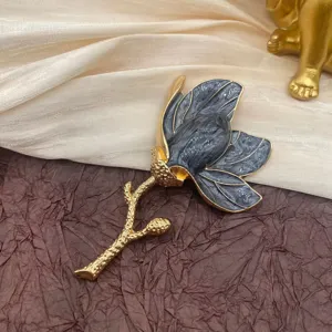 Detailed view of a vintage tulip enamel brooch with grey petals and gold stem