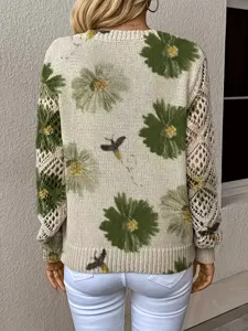 Detail view of bohemian floral knit sweater featuring elegant hollow-out mesh sleeves design