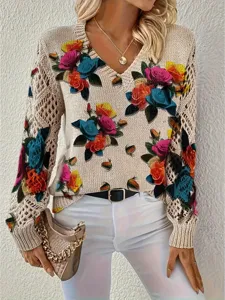 Detail of bohemian floral print V-neck sweater with hollow-out knit sleeves.