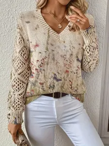 Detail of bohemian floral V-neck sweater with elegant crochet hollow sleeves