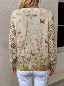 Detail view of Bohemian floral printed knit sweater with crochet hollow-out sleeves