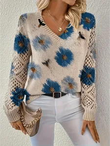Close-up of elegant bohemian floral V-neck sweater with hollow-out knit sleeve details