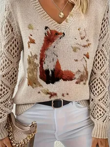 Close-up of elegant boho V-neck sweater with fox print and hollow mesh sleeves