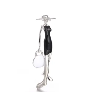 Elegant creative enamel lady brooch featuring a stylish silver silhouette with a black dress