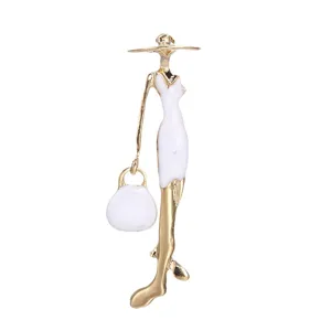 Elegant gold and white enamel lady brooch pin with hat and handbag fashion accessory