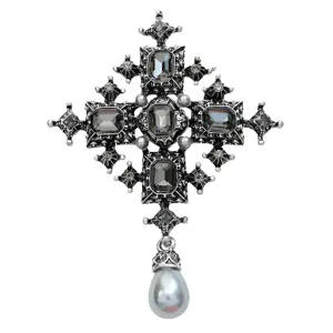 Vintage silver-tone cross brooch with dark rhinestones and elegant grey pearl drop