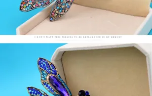 Close-up of vintage dragonfly brooch with intricate blue and purple rhinestone detailing