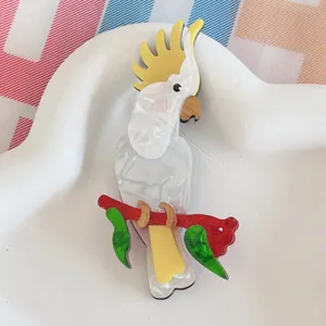Detailed view of handcrafted acrylic cockatoo parrot brooch with vibrant colors