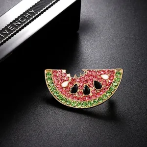 Detailed macro shot of watermelon slice brooch with pink and green sparkling rhinestones