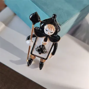 Detailed view of a vintage spade soldier brooch crafted from black enamel and alloy